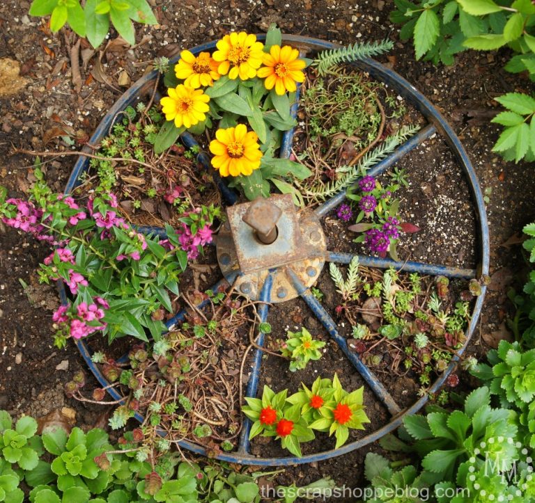 Wagon Wheel Planter - turn an old wagon wheel into a fun planter for the flower garden!