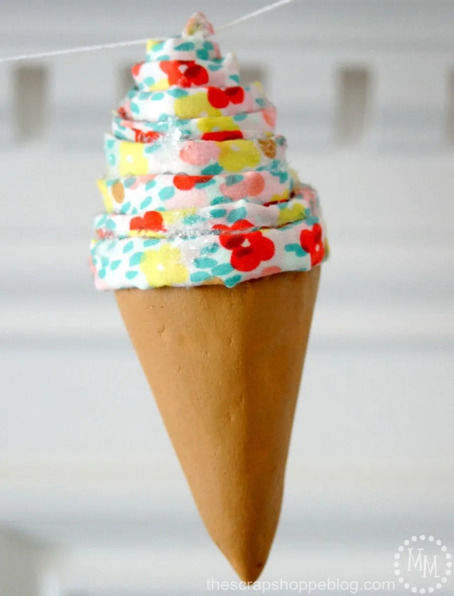Foam Ice Cream Cone Garland using cones and fabric. So fun for an ice cream party! #MakeItFunCrafts