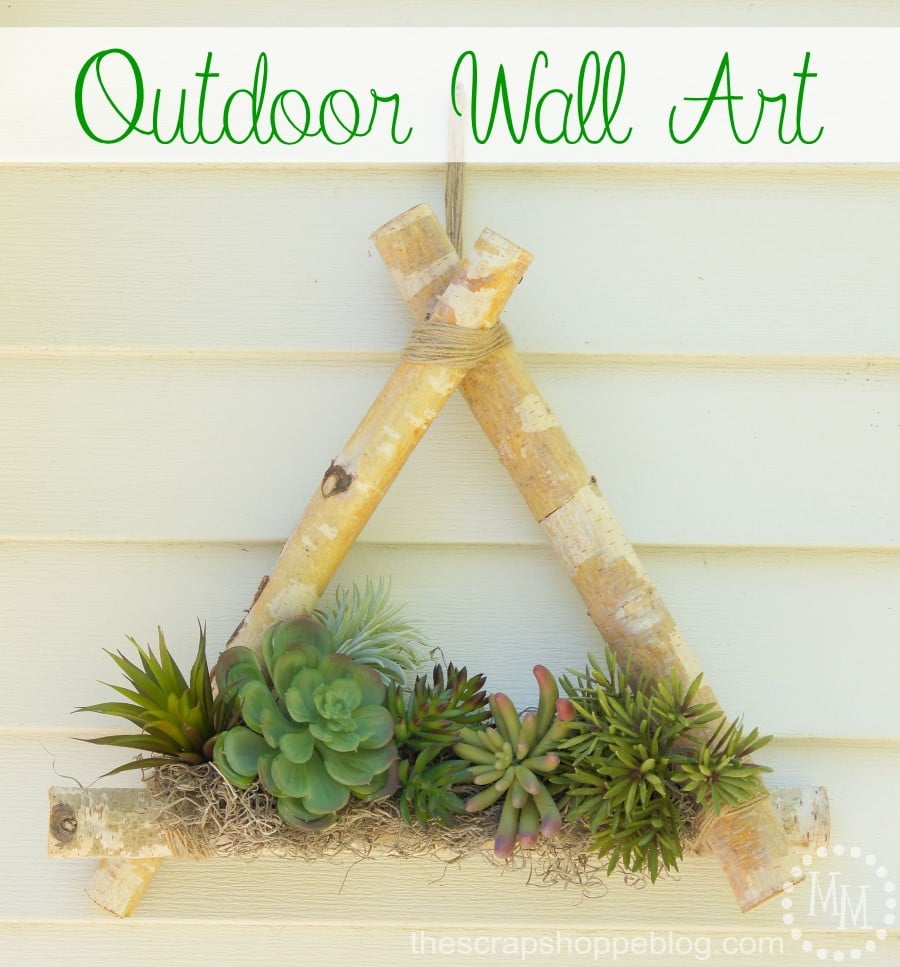 Outdoor wall art with pre-cut birch logs and faux succulents