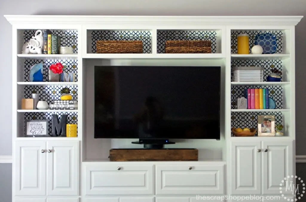 This plain Jane media center got a fun makeover with adhesive vinyl!