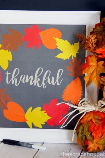 Use metallic vinyl on scrapbook paper to make a pretty wreath. Frame it and use it as a dry erase board to write what you're thankful for on!