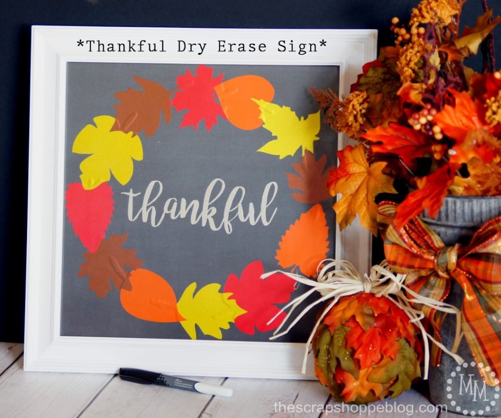 Use metallic vinyl on scrapbook paper to make a pretty wreath. Frame it and use it as a dry erase board to write what you're thankful for on!