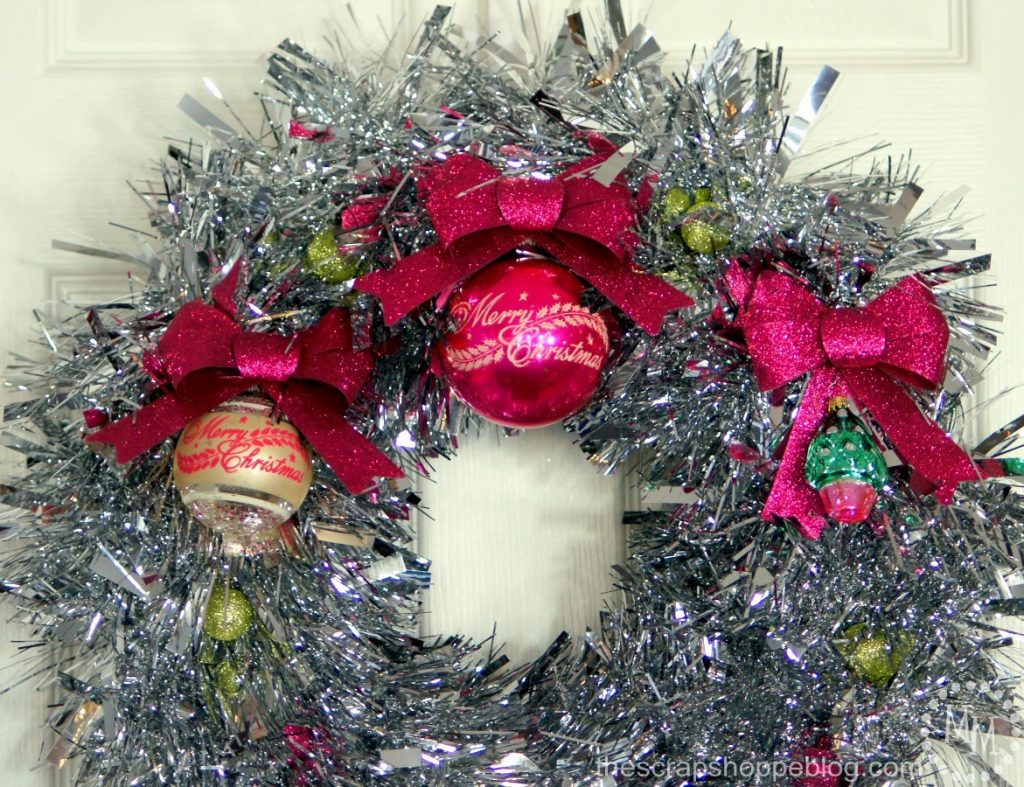 Giant tinsel garland make a fantastic vintage-looking wreath! Add vintage ornaments to complete the look.