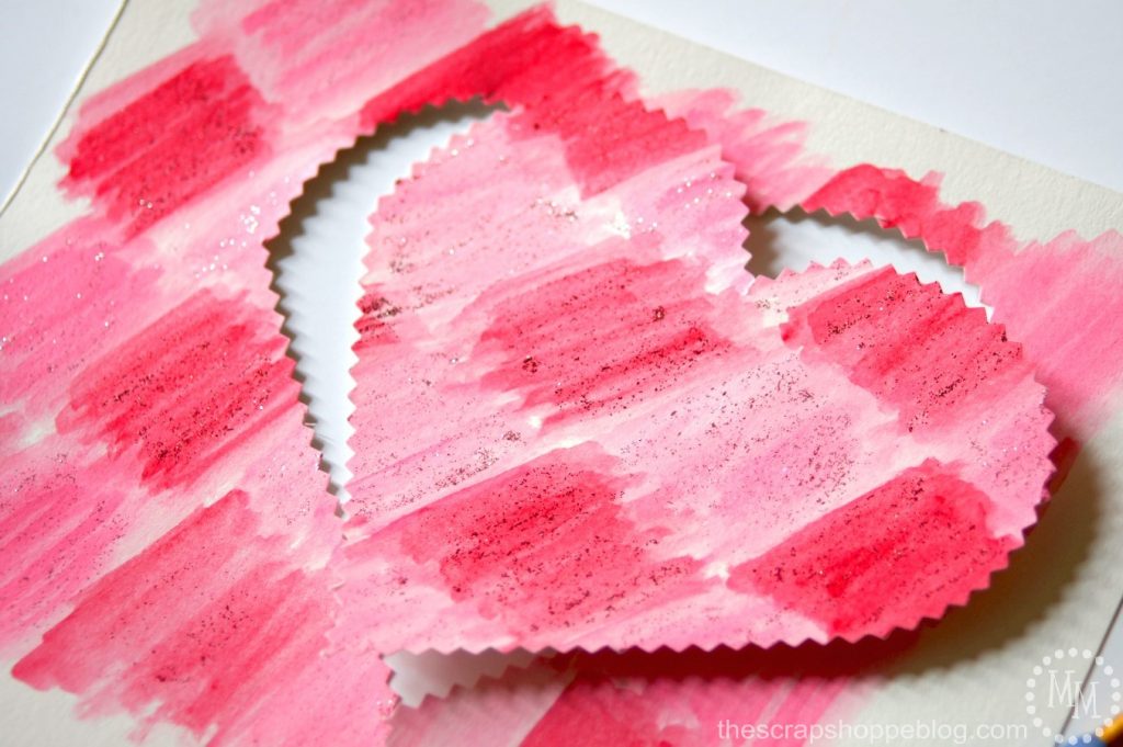 DIY your own watercolor Valentines stuffed full of chocolates with just a handful of supplies!