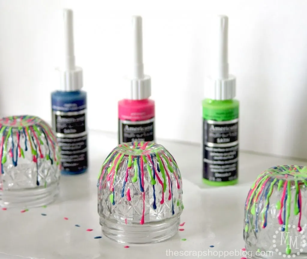 Get your desk organized in a bold way with some fun dripped paint storage jars!