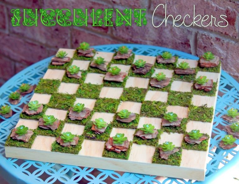 Up your outdoor gaming with a moss and wood checkerboard and faux succulents as the checker pieces.