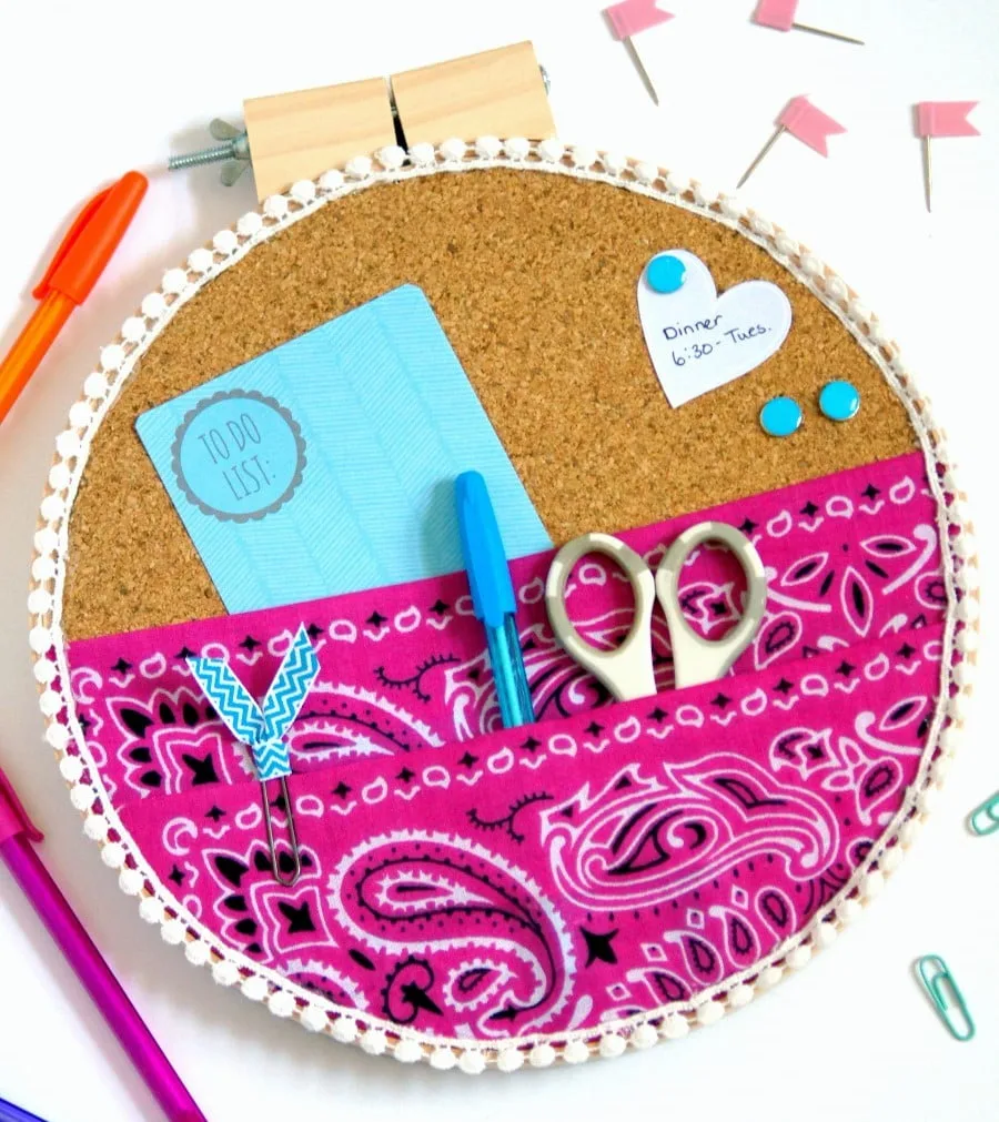 Take your organization UP off of your desk and onto your wall with an embroidery hoop organizer!