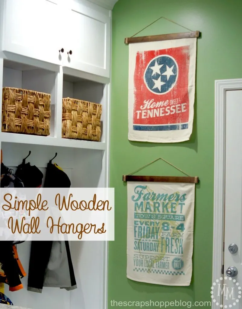 Hang fabric or paper wall decor with ease and with no holes in the material with these simple wooden wall hangers!