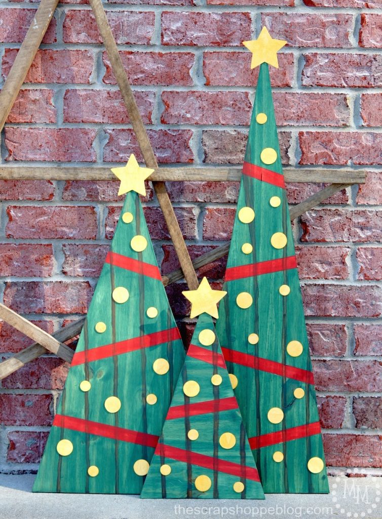 Use stain to create the look of pallets on regular wood! These stained Christmas trees are fun outdoor holiday decorations.