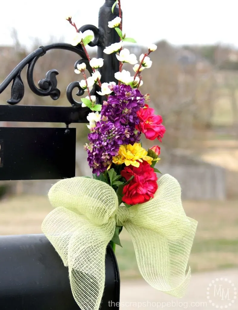 Dress up your mailbox for spring and summer with a pretty bouquet of faux flowers.