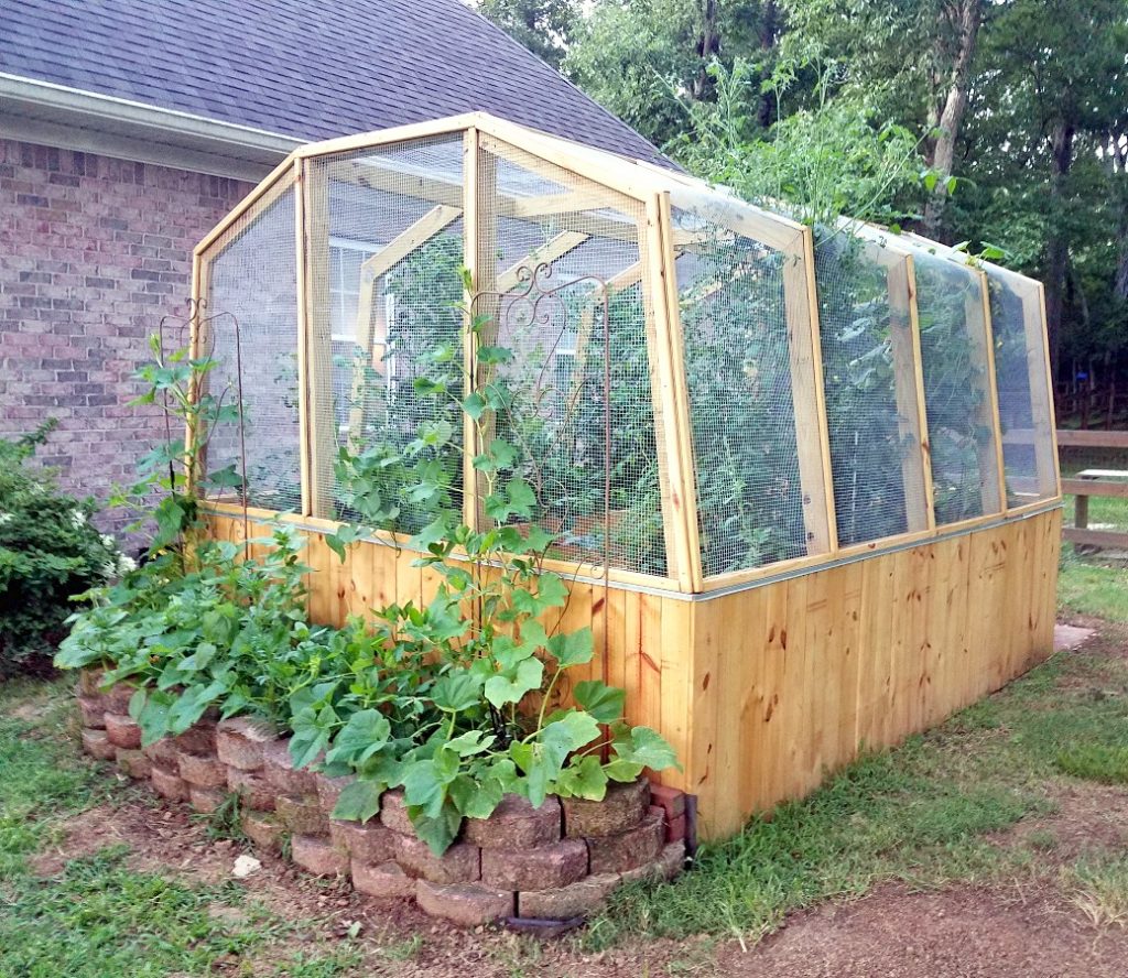 Don't let critters in your garden get you down, build a DIY Enclosed Garden Greenhouse to keep them out!